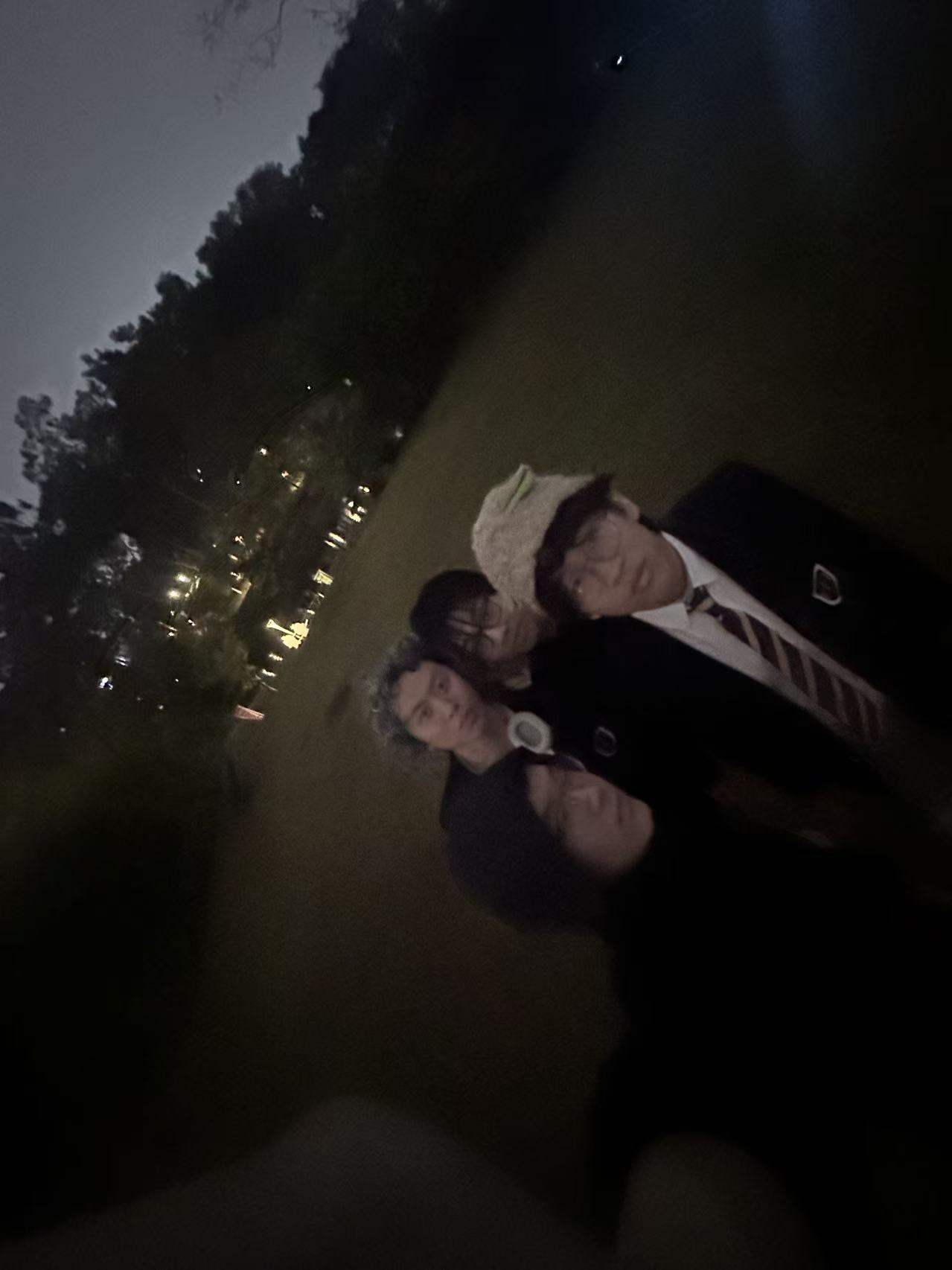 Late-night photo with classmates on the HFI campus.