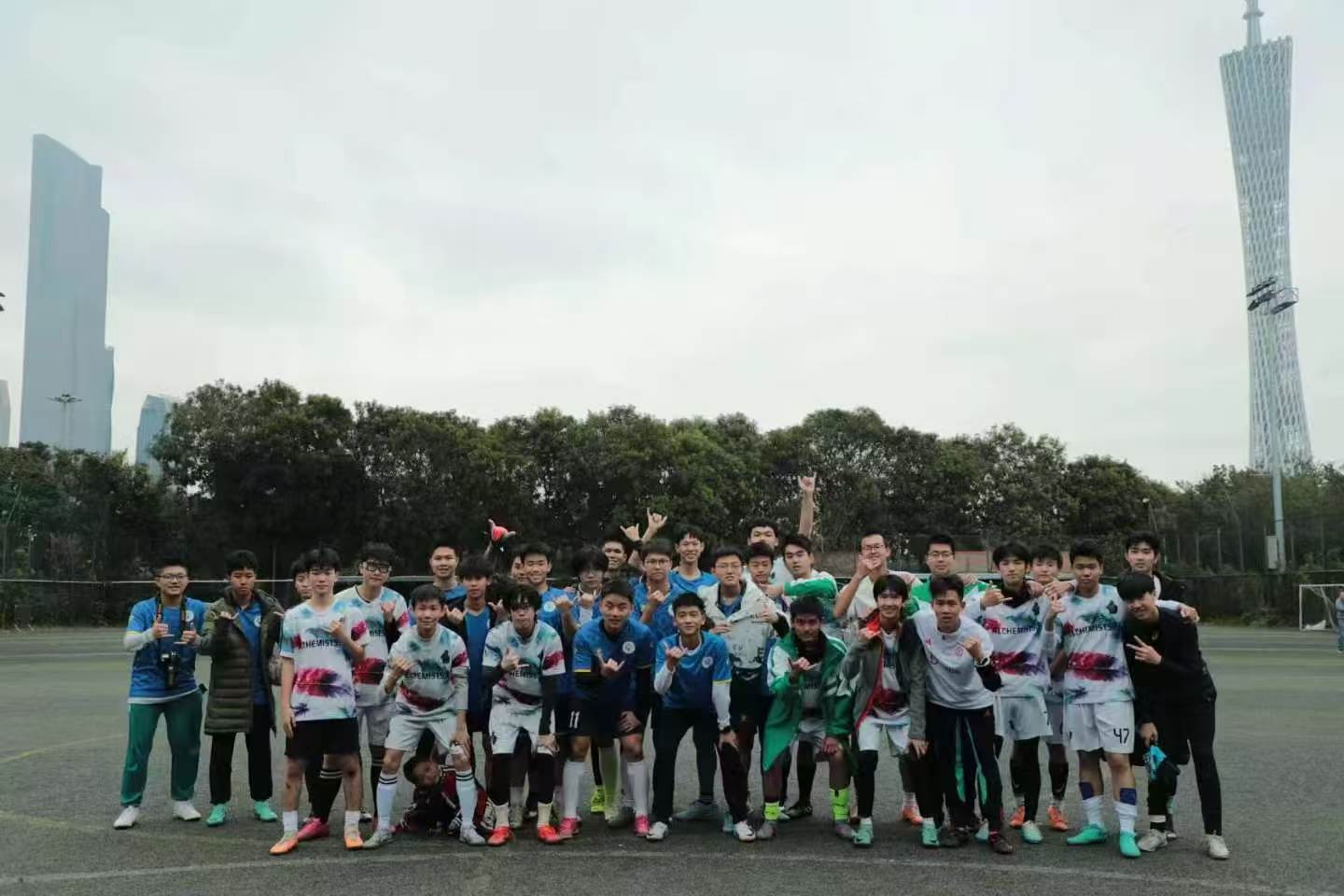 Soccer team with Guangzhou skyline
